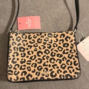 Small Kate Spade crossbody purse in leopard print.